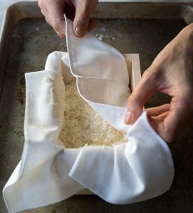 Pressing tofu into mold