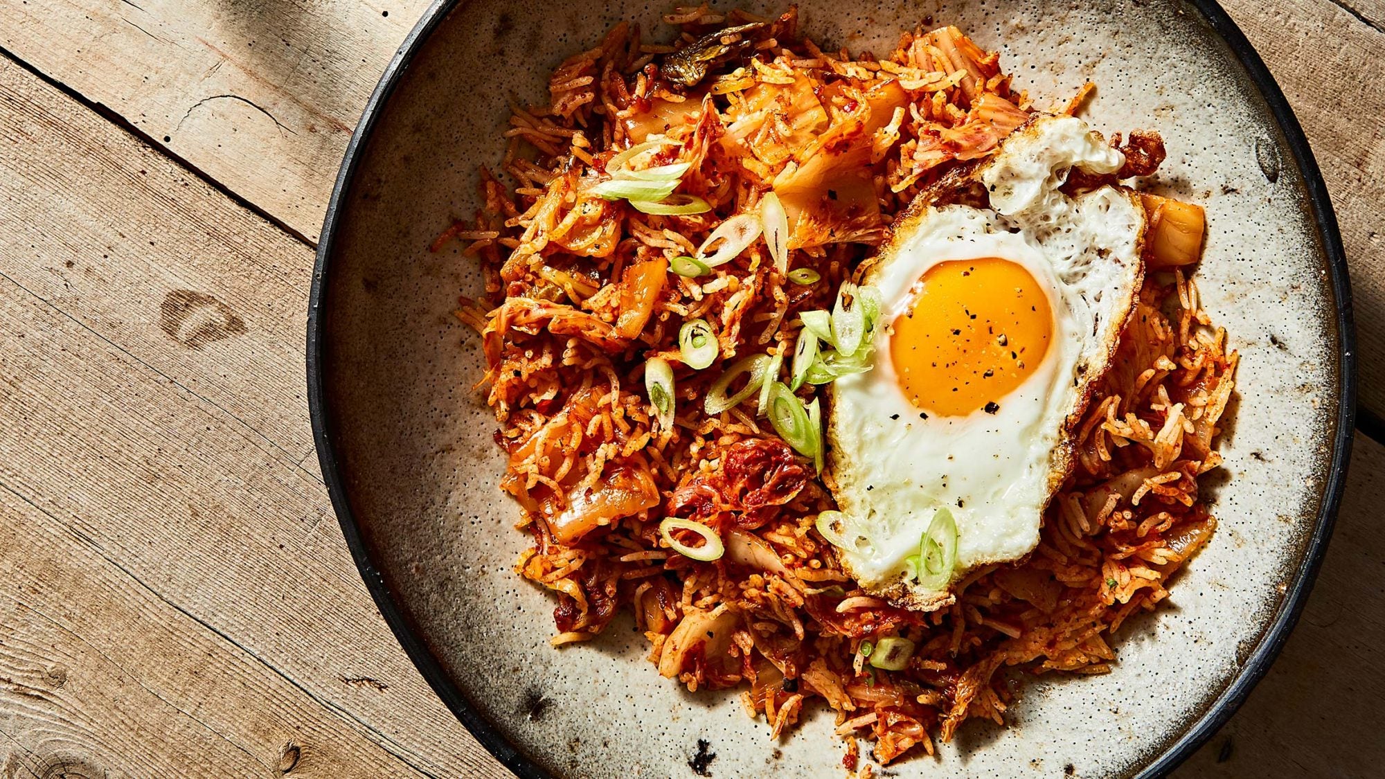 https://tastecooking.com/wp-content/uploads/2021/06/Article-Hangover-Food-Ketchup-Kimchi-Fried-Rice-2000x1125.jpg